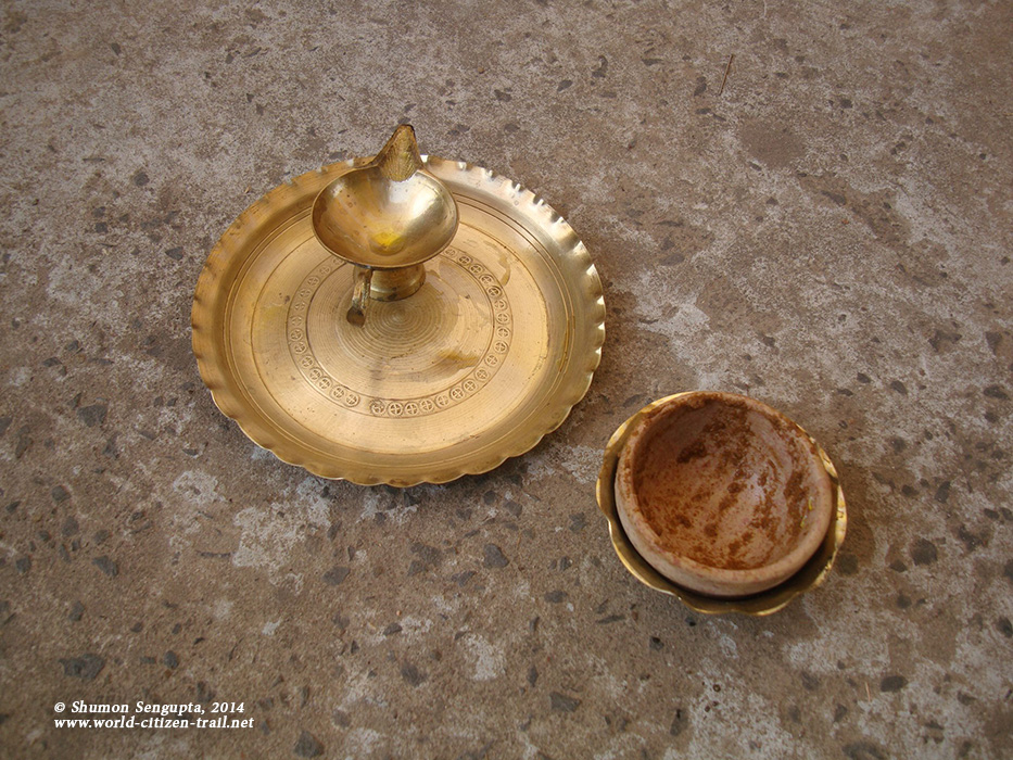 Traditional items (lamp and sandal wood paste) used at the Convocation to light the lamp and to welcome guests.
